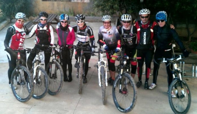  several cyclists with their bicycles 